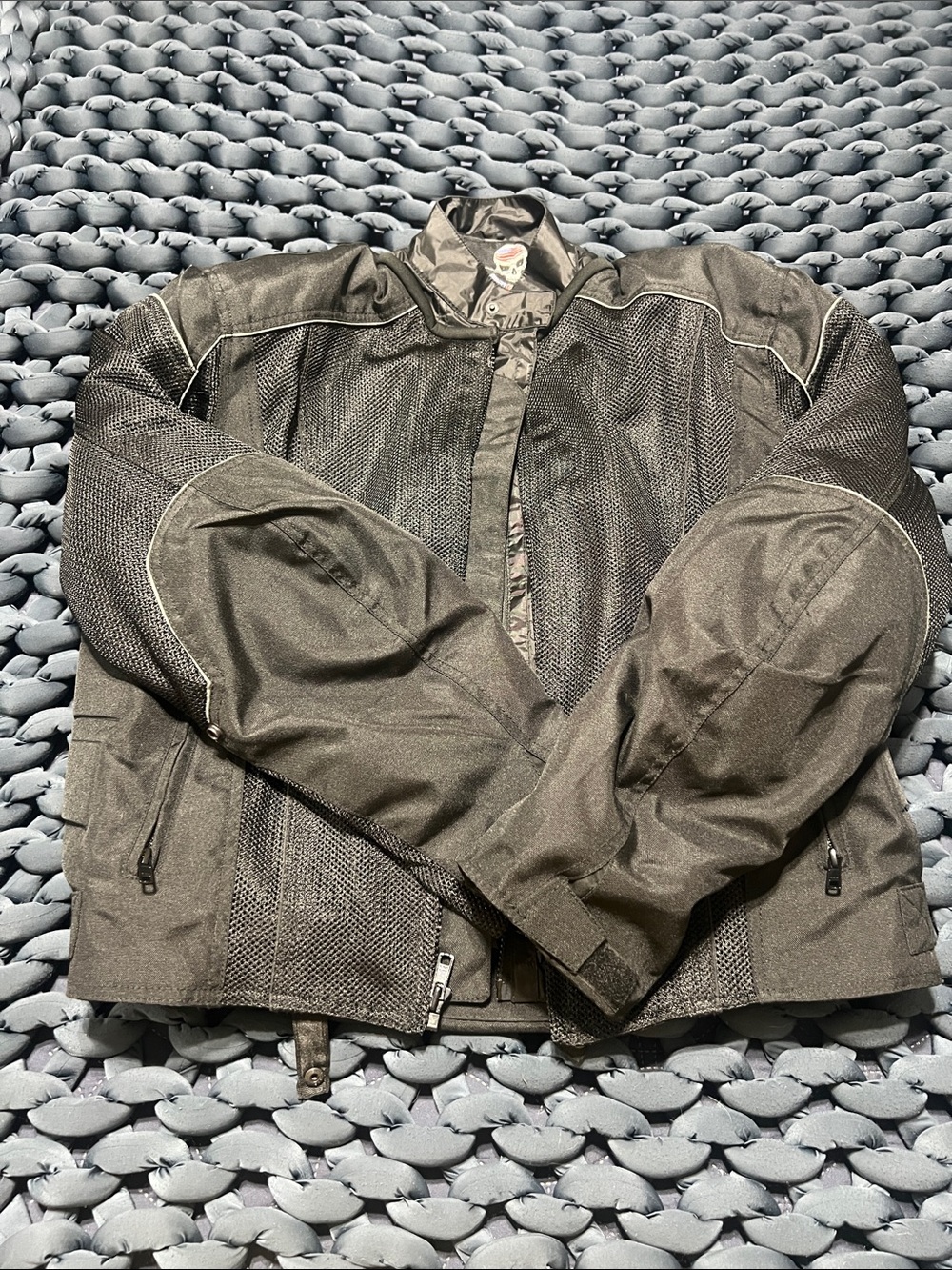 Wicked Stock motorcycle jacket with liner and back guard. Size large.
